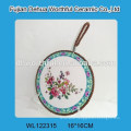 Flower design ceramic pot mat with blue rope